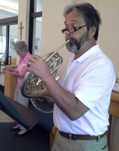 Phil Richardson plays French horn during worship at PEACE.
