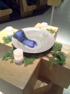 Caly baptismal font with candles