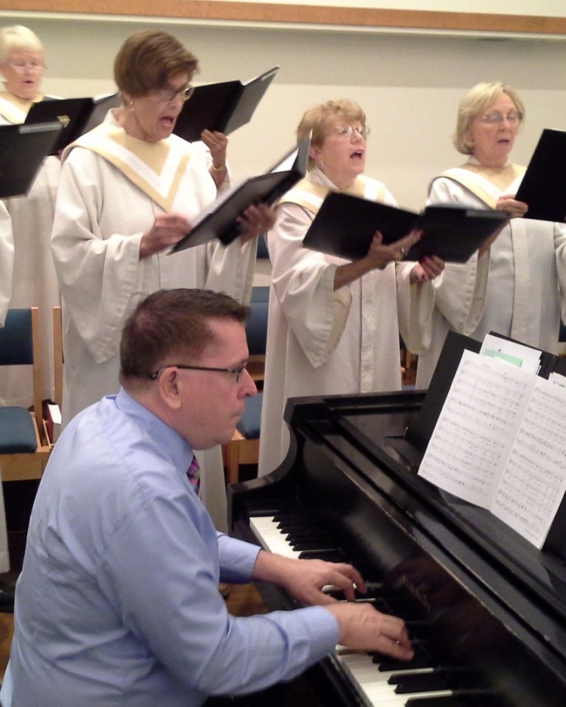 Staff musician Walt Strony plays piano and organ at PEACE Lutheran Church.