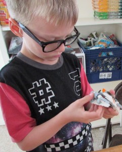 Athan Kerr, 8, loves the challenge of Legos. His life has stabilized, thanks to the Salvation Army's Booth Family Center.