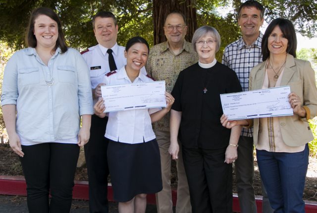 The Salvation Army’s Booth Family Center and Hospitality House recently received checks for $14,139 each from Peace Lutheran Church – the proceeds of the Grass Valley church’s “Leap of Faith” fundraising campaign to help area homeless men, women and children. Pictured are, from left, Social Services Director Sarah Eastberg, Lt. Sid Salcido and Lt. Reyna Salcido, of the Salvation Army; congregation President Perry Studt and Pastor Eileen Smith Le Van of PEACE Lutheran Church; and board Vice President Michael McDonald and Development Director Debbie McDonald of Hospitality House.