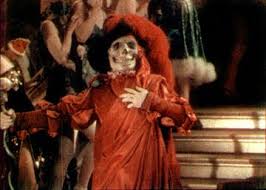 Actor Lon Chaney arrives at a masked ball dressed as "Red Death" in "The Phantom of the Opera."
